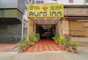 The entrance of Aura Inn with a red carpet leading to the reception area. - Fabhotel Aura Inn (Bangalore)