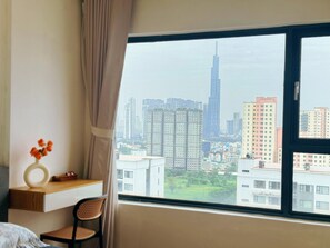 Family Apartment, 3 Bedrooms, City View | Desk, iron/ironing board, free WiFi, bed sheets - TPHomes New City (Ho Chi Minh City)