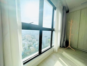 Family Apartment, Partial Ocean View | Desk, blackout drapes, iron/ironing board, free WiFi