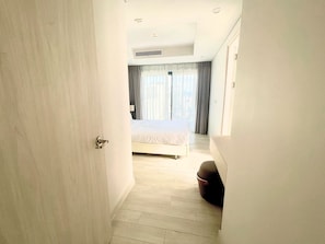 Family Apartment, Partial Ocean View | Desk, blackout drapes, iron/ironing board, free WiFi