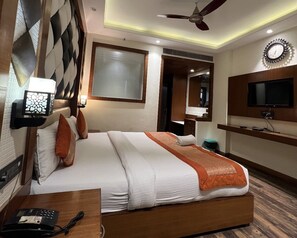 Habitación ejecutiva | Ropa de cama de alta calidad y escritorio 