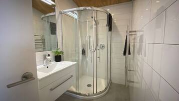 Shower, hair dryer, towels, soap