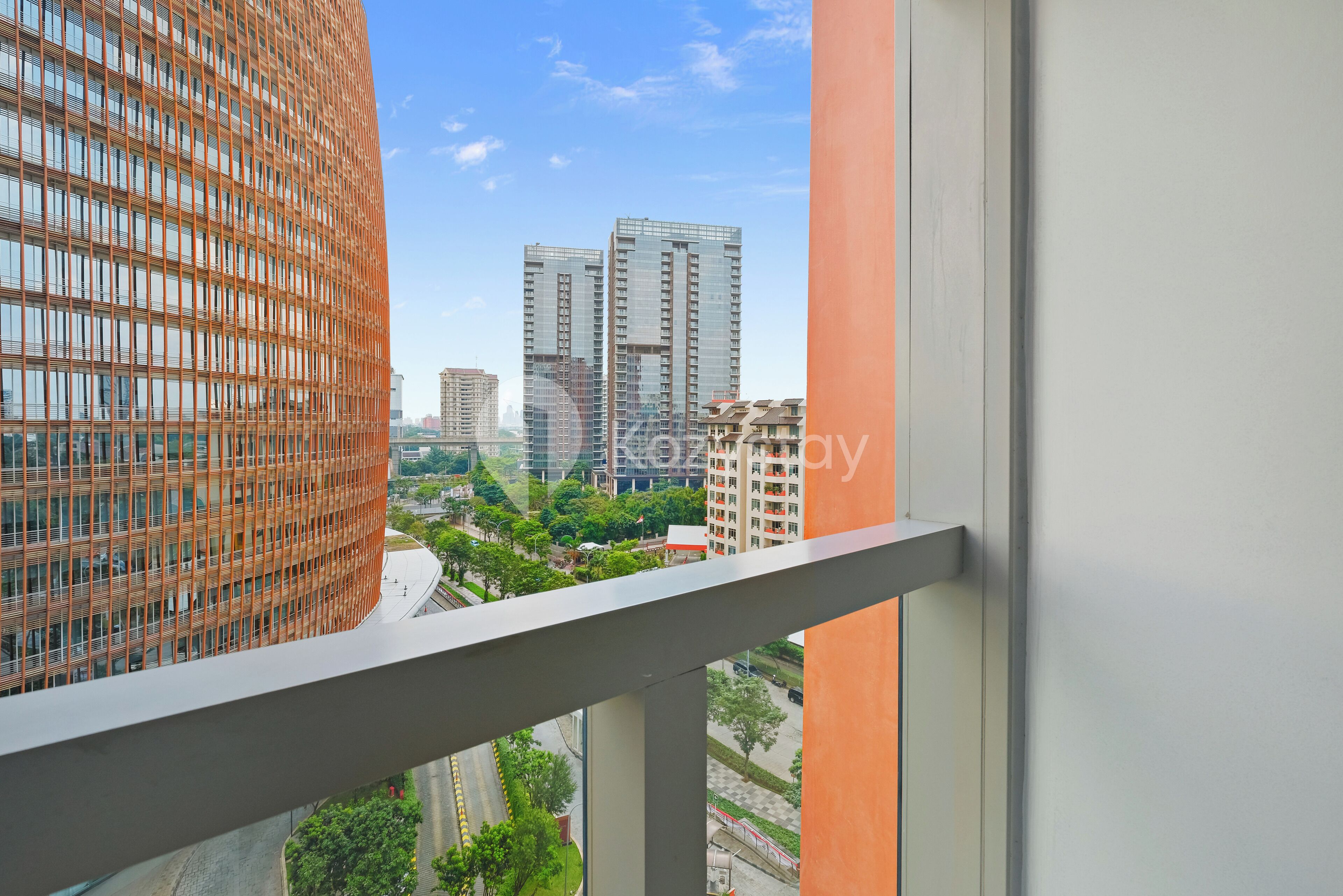 A high-rise building with a grid-like facade and a view of other buildings in the background.