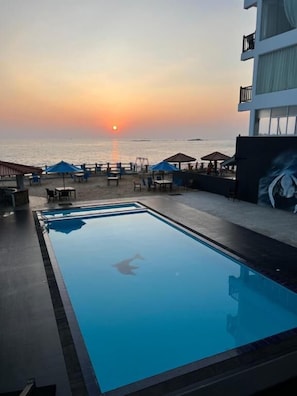 Outdoor pool, pool umbrellas, pool loungers