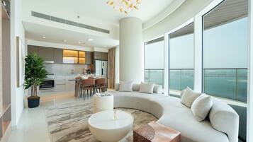 Deluxe Apartment, 2 Bedrooms, Beachside | Living area | 125-inch Smart TV with satellite channels, Netflix, streaming services