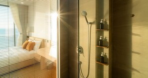 Separate bathtub and shower, hair dryer, slippers, towels