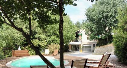 Large garden with swimming pool.