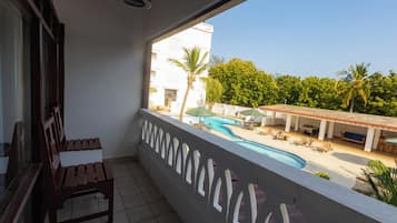 Standard Double Room, Balcony, Pool View | In-room safe, desk, laptop workspace, blackout drapes