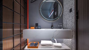 Shower, hair dryer, slippers, towels