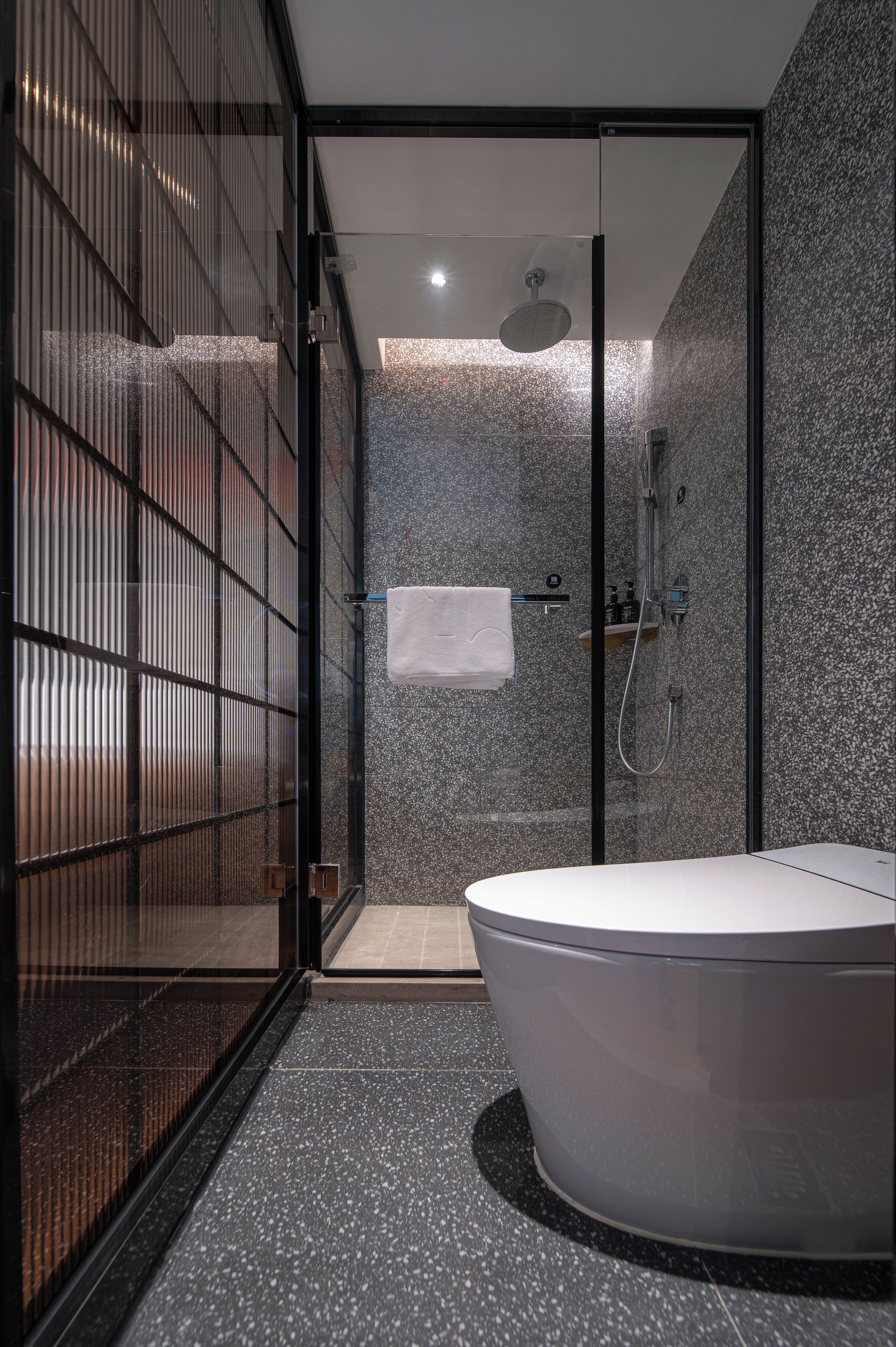 Shower, hair dryer, slippers, towels