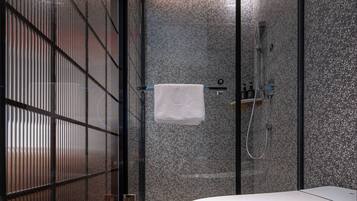 Shower, hair dryer, slippers, towels