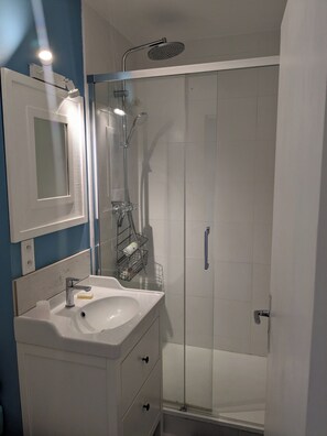 Shower, eco-friendly toiletries, hair dryer, towels