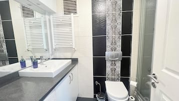 Hair dryer, towels, soap, toilet paper