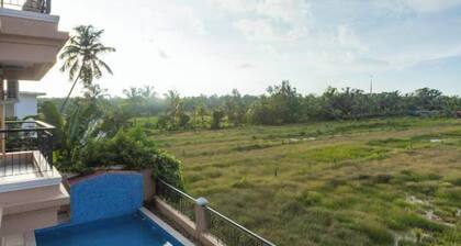 Palm Retreat 1BHK Pool & Field Views