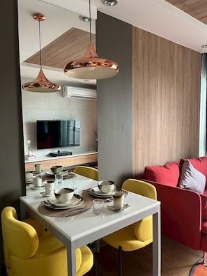Luxury Room | Living area | 55-inch Smart TV with cable channels