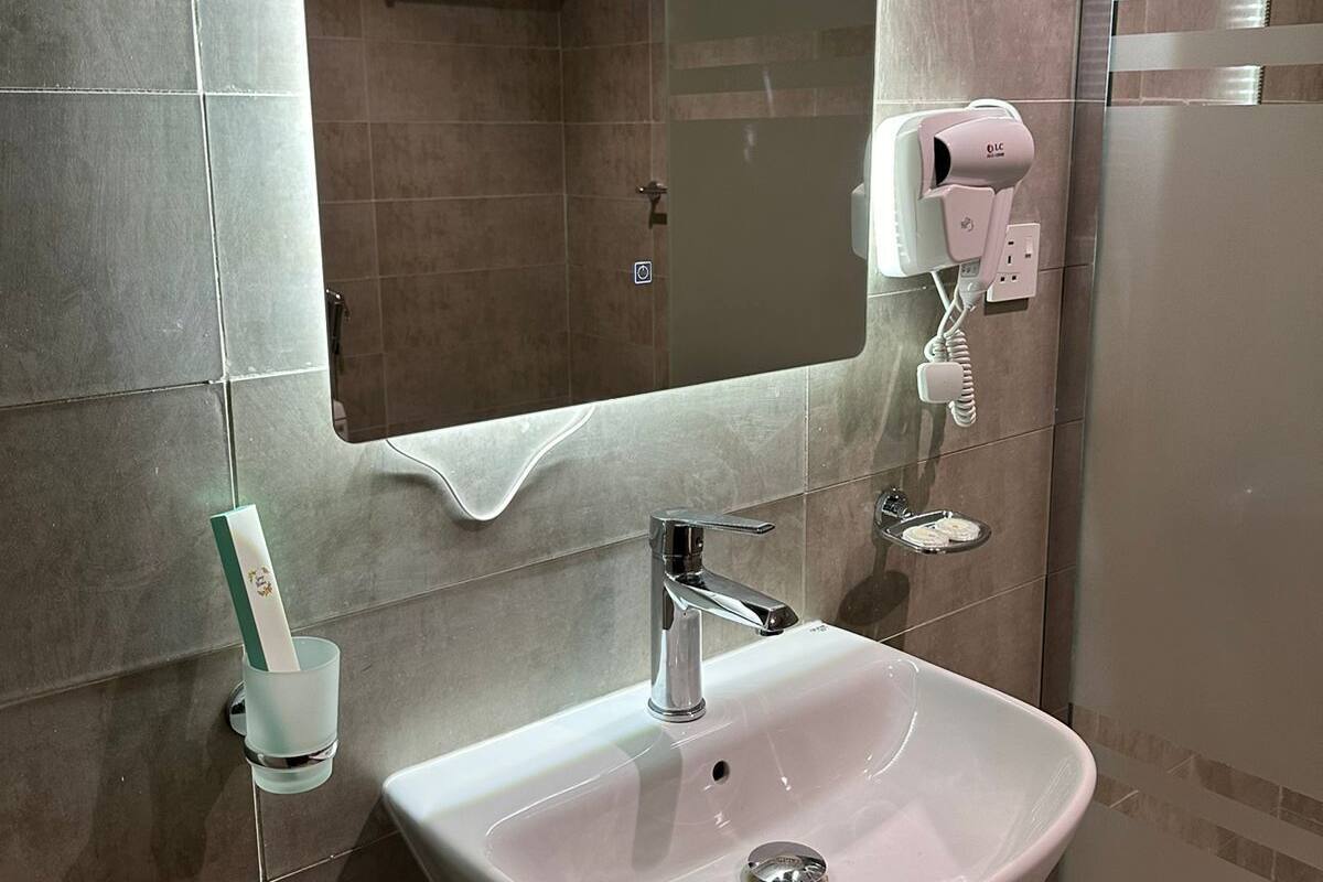 Hair dryer, slippers, towels, soap