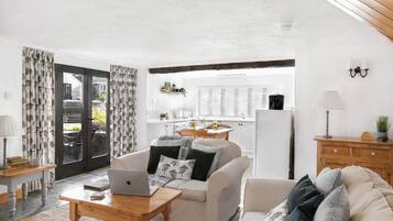 Honeysuckle Cottage, Patio, Courtyard View | Living area | Flat-screen TV