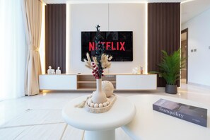 Deluxe Apartment, 1 Bedroom | Living area | 125-cm Smart TV with cable channels, Netflix, streaming services