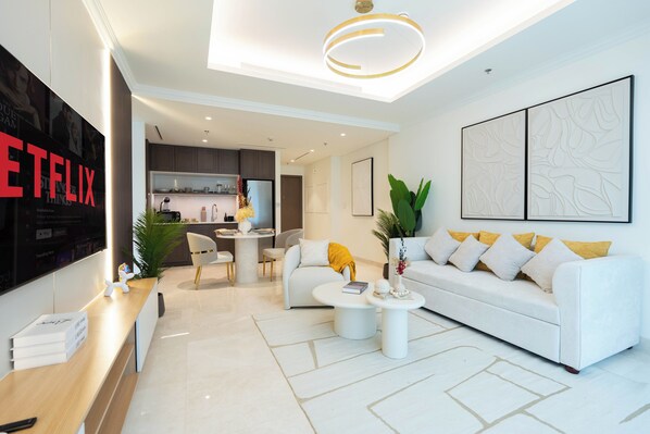 Deluxe Apartment, 1 Bedroom | Living area | 125-cm Smart TV with cable channels, Netflix, streaming services