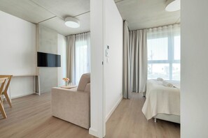 1 bedroom, desk, iron/ironing board, travel crib