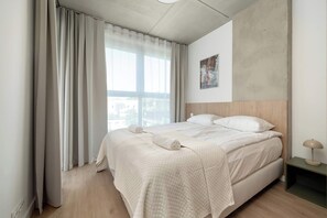 1 bedroom, desk, iron/ironing board, travel crib