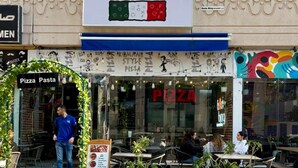 A storefront with a sign reading "BADA BING" and "Sourdough Pizzeria & Bakery". - Spacious 3BR Marina Stay With City Views (Dubai)