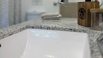 Hair dryer, towels, soap, shampoo