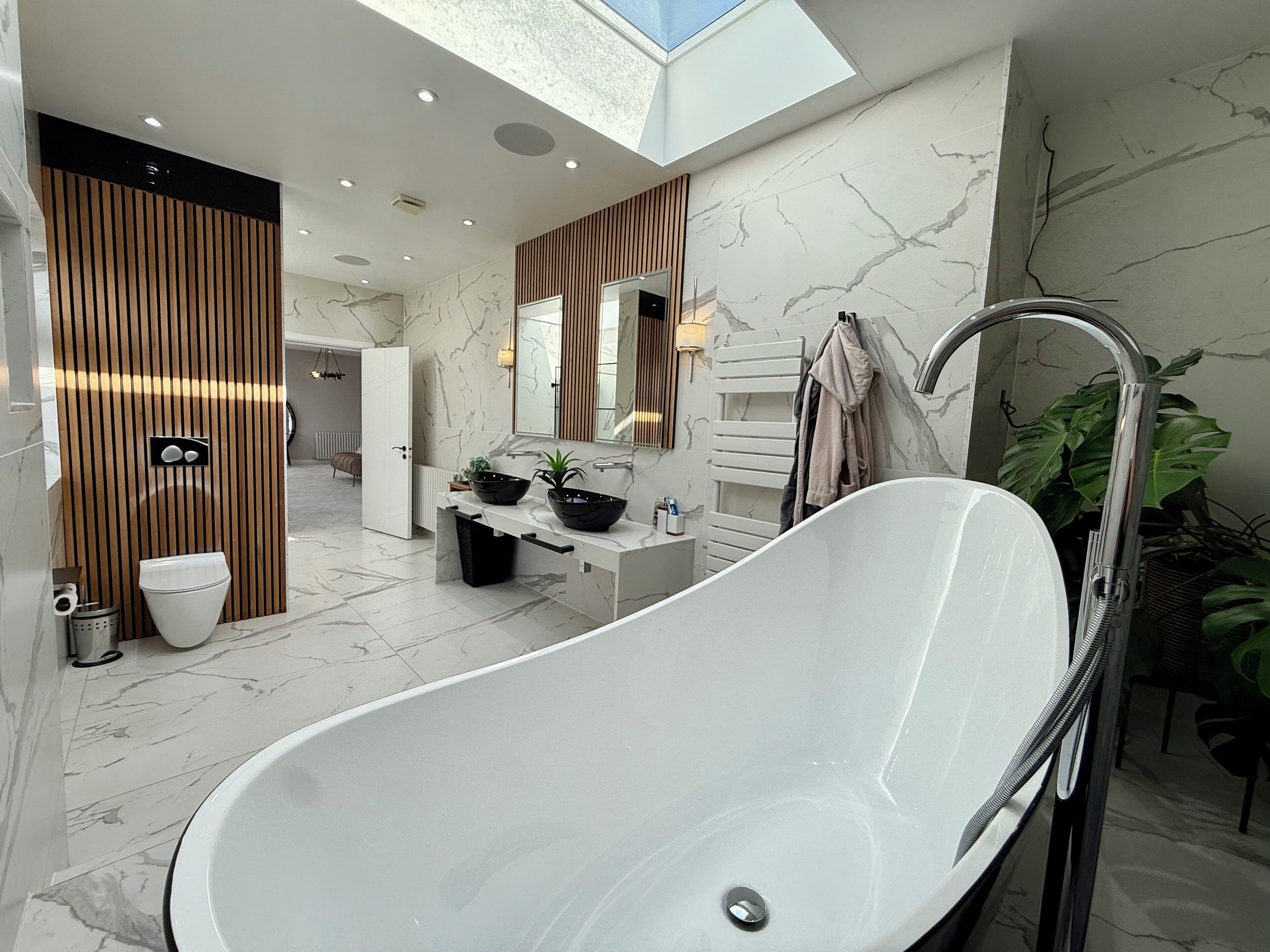 Shower, hair dryer, slippers, towels
