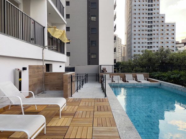 Outdoor pool, open 8:00 AM to 10:00 PM, pool umbrellas, pool loungers