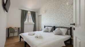 2 dormitorios, tabla de planchar con plancha, wifi gratis y ropa de cama