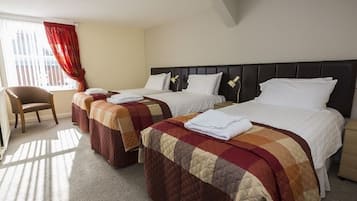 Deluxe Triple Room, Courtyard View | Desk, laptop workspace, blackout drapes, soundproofing