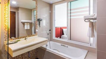 Deluxe Plus Room | Bathroom | Combined shower/bathtub, free toiletries, hair dryer, slippers