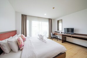 Deluxe Room | In-room safe, desk, laptop workspace, blackout drapes - The Kris Resort Hotel (Patong)