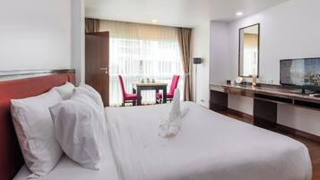 Deluxe Plus Room | In-room safe, desk, laptop workspace, blackout curtains