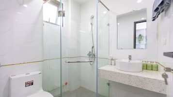 Family Apartment | Bathroom | Shower, hair dryer, slippers, towels