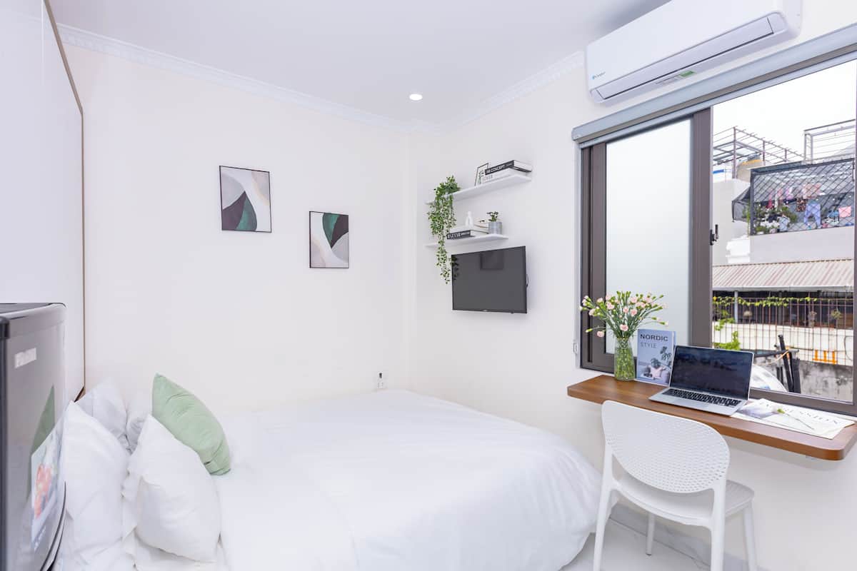 Laptop workspace, blackout curtains, soundproofing, iron/ironing board