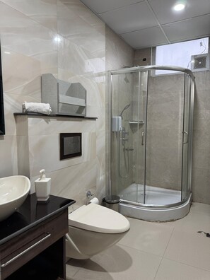 Shower, rainfall showerhead, towels, soap