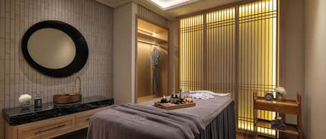 A modern bedroom with a large bed, a vanity with a mirror, and a wooden dresser.