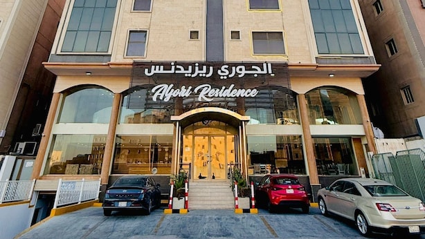 A multi-story building with a prominent entrance labeled "Alvori Residence."