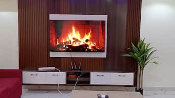 Signature Apartment, 3 Bedrooms, Non Smoking, City View | Living area | Flat-screen TV, fireplace