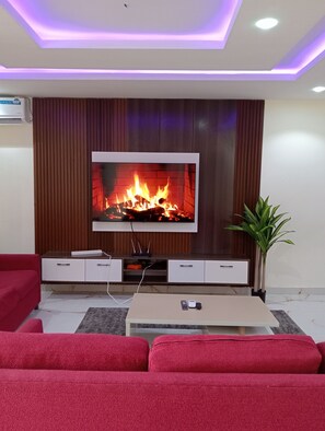 Signature Apartment, 3 Bedrooms, Non Smoking, City View | Living area | Flat-screen TV, fireplace - Pinefield Courts Apartmentl (Akure)
