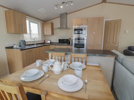 Fridge, microwave, toaster, cookware/dishes/utensils