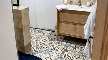 Shower, hair dryer, towels, soap