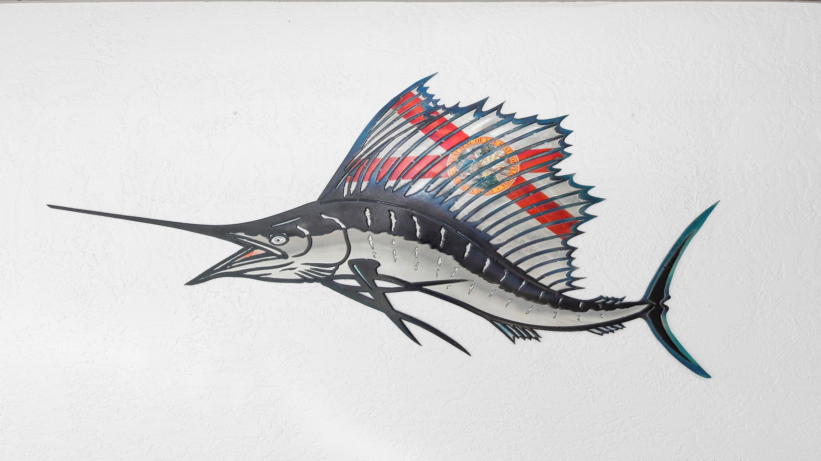 A detailed illustration of a fish with prominent fins and a long tail.