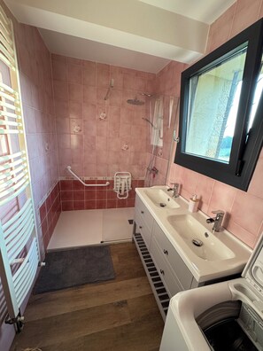 Shower, towels, soap, toilet paper