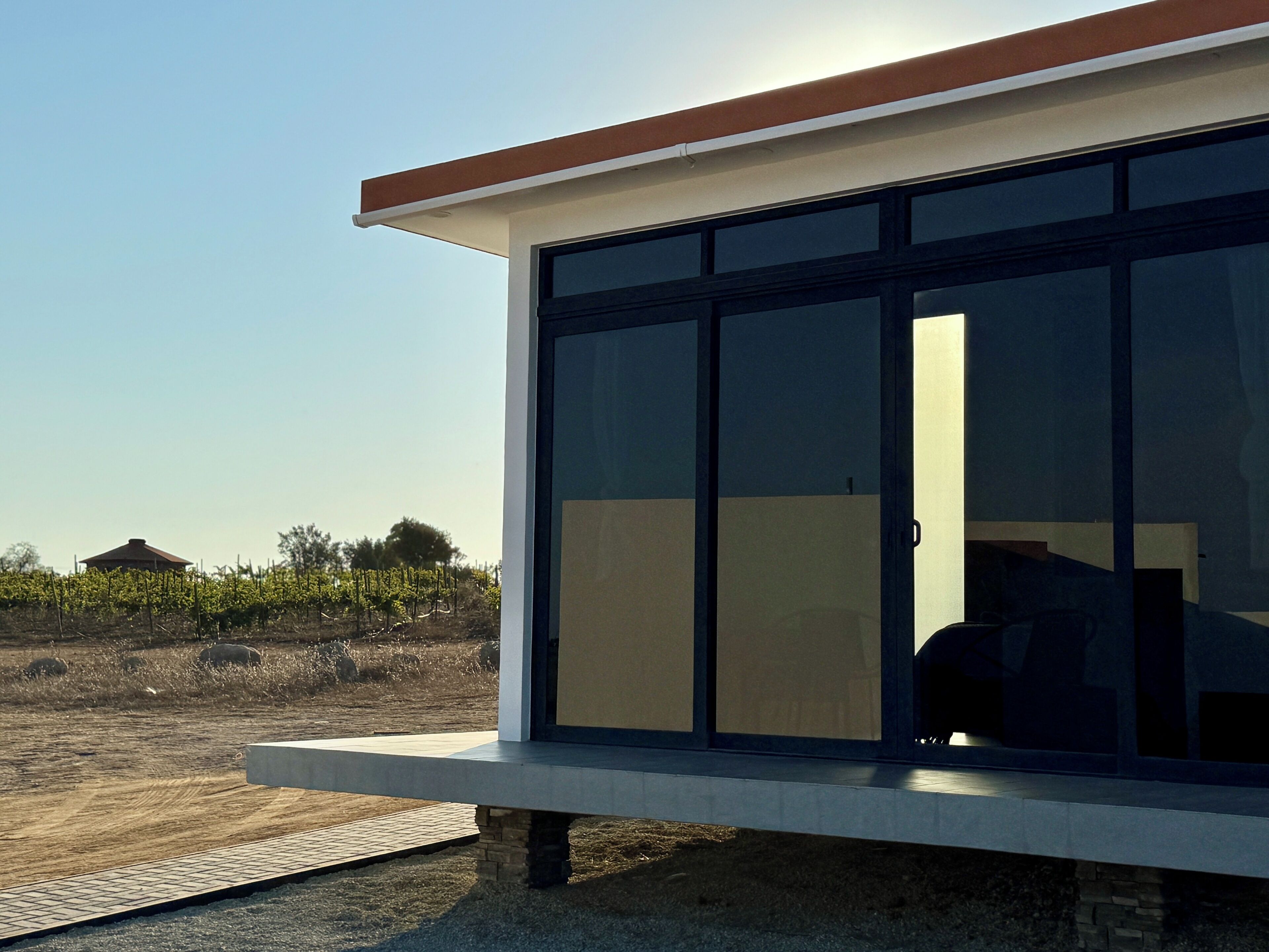 A modern building with large windows and a flat roof.