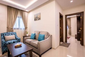 Standard Apartment, 1 Bedroom | Living room | 32-inch flat-screen TV with satellite channels