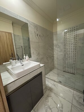 Shower, hair dryer, towels, soap