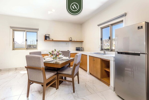 Fridge, microwave, stovetop, coffee/tea maker