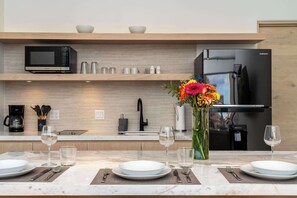 Fridge, microwave, stovetop, coffee/tea maker